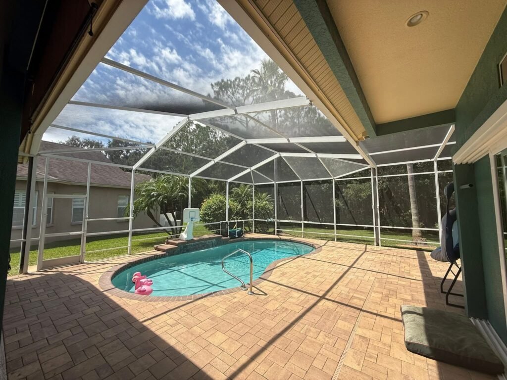 Pool enclosure installation in Winter Haven, FL covering residential backyard swimming pool